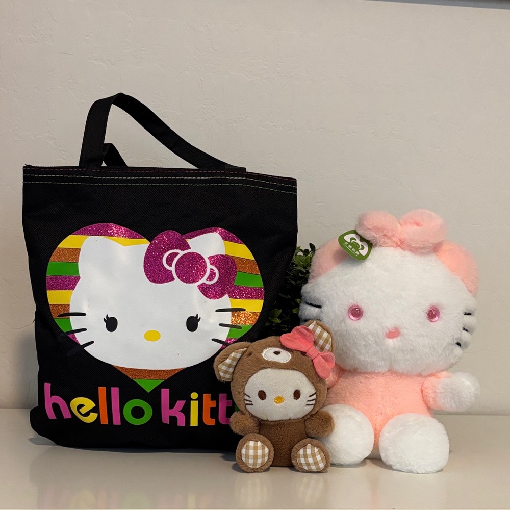 Like New Hello Kitty small tote bag and 2 stuffed animals.